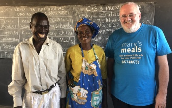 priest with volunteers