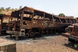Image of an abandoned bus left rusting and broken.