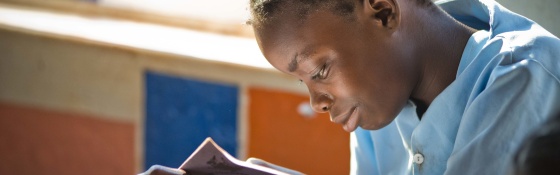 Girl reads book in Liberia