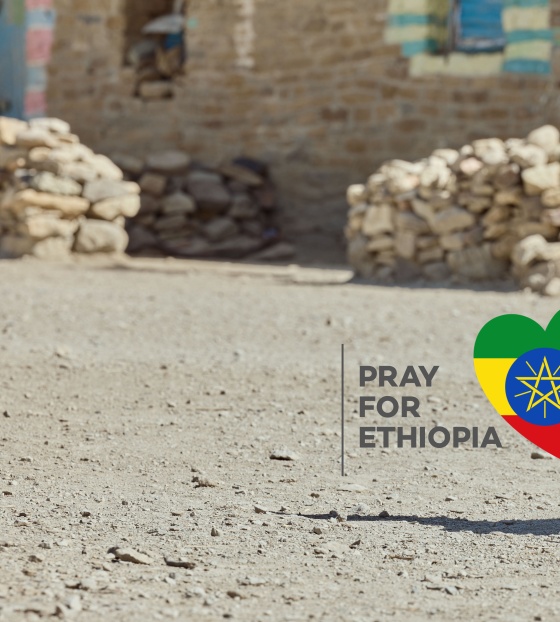 Pray for Ethiopia Campaign banner showing a child sitting on the ground.