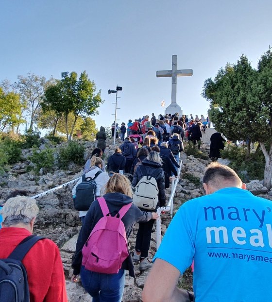 people climbing on the hill