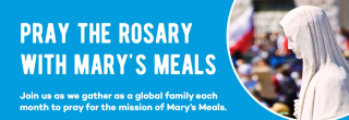 Card which reads "Pray the rosary with Mary's Meals. Join as a we gather as a global family each month to pray for the mission of Mary's Meals."