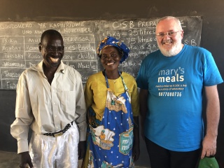 priest with volunteers