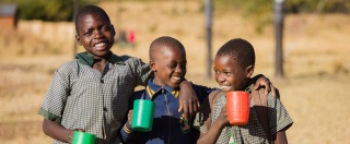 Children receiving their daily meal